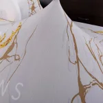 housse de canapé blanc marbré avec motif or