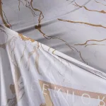 housse de protection pour canapé blanc marbré or