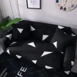 housse de protection pour canapé noir et blanc