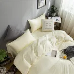 housse de couette assortie aux taies d'oreiller blanc cassé