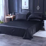 taies d'oreiller noires satinées