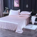 2 taies d'oreiller rose clair type satin